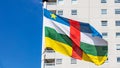 Central African Republic flag waving against clear blue sky