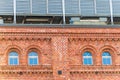 Central air handling unit housing located on the roof of the old, traditional, industrial brick building Royalty Free Stock Photo