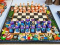 Central Asia. Handmade wooden colorful chess in the form of Uzbek figures