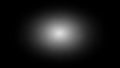 Central bright white light source with a soft grey gradient on black Royalty Free Stock Photo