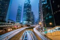 Central business district with traffic lights trail and modern business tower at Hong Kong city night Royalty Free Stock Photo