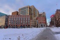 Central Chambers in Queen Anne revival style and modern buildings along Elgin street, covered in snow in Ottawa