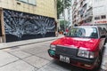 Central district Hong Kong city modern art street view with traditional style red taxi car most popular travel place in asia Royalty Free Stock Photo