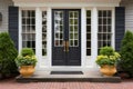 central front door of a colonial house with symmetrical windows