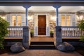 central front door of a stone clad colonial house