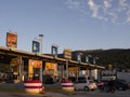 Central Greece. December 2019: Trip on the toll highway Athens-Thessaloniki, past cars, gas stations, toll checkpoints at sunset i