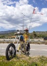 Central Greece, June 2020: Art object skeleton on a motorcycle-chopper Ghost rider on the autobahn in Greece Royalty Free Stock Photo