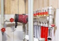 Central heating in the basement of the building. Adjustable pump and manifolds Royalty Free Stock Photo