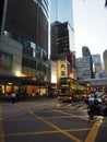 A photo of one of the many doubledeck buses driving around on Des Voeux Road Central in