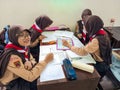 A group of students are learning to recognize and translate the Javanese script in class. Royalty Free Stock Photo