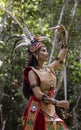 Central Kalamantan, Indonesia, May 20, 2022 - Woman poses in traditional indiginous garb or a warrior Royalty Free Stock Photo