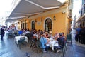 Central Kapodistriou street in Corfu, full of tourists eating in various restaurants