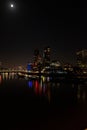 Central London at night during with a full moon in view