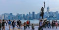 Central Monument of Avenue of Stars and Street Scenario of promenade. Skyline of Hongkong Island in background. Hong Kong, China