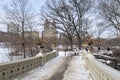 New York City, New York, United States - February 14, 2021: Central Park and Bow bridge in the winter with frozen lake Royalty Free Stock Photo