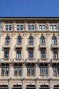 Central part of the facade, with statues, an important building in Trieste in Friuli Venezia Giulia (Italy) Royalty Free Stock Photo