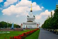 Central pavilion, exhibition center on the blue sky background. Red flowers. Fountain. ENEA,VDNH,VVC. Moscow, Russia. Royalty Free Stock Photo