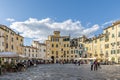 The central Piazza Anfiteatro square in Lucca, Italy, on a sunny day