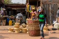 Unidentified Ghanaian man passes by the basins in local village