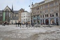 Central square in Amsterdam pigeons and carriages with horses