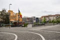 Central square with concrete pavement in the downtown of the modern city Ramnicu Valcea. Romanian travel destination. Ramnicu