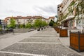 Central square with concrete pavement in the downtown of the modern city Ramnicu Valcea. Romanian travel destination. Ramnicu