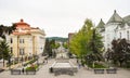 Central square with concrete pavement in the downtown of the modern city Ramnicu Valcea. Romanian travel destination. Ramnicu