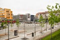 Central square with concrete pavement in the downtown of the modern city Ramnicu Valcea. Romanian travel destination. Ramnicu