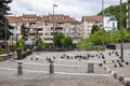 Central square with concrete pavement in the downtown of the modern city Ramnicu Valcea. Romanian travel destination. Ramnicu