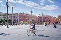 Nice, Provance, Alpes, Cote d `Azur, French, August 15, 2018; View of the place Massena square with people riding a bike