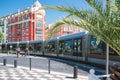 Nice, Provance, Alpes, Cote d`Azur, French July 31, 2018; Square Massena with red buildingPublic transport - tram on the road.