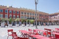 Nice, Provance, Alpes, Cote d`Azur, French July 31, 2018; View of the Place Massena square in Nice with red tables in foreground.