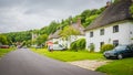 Central street in a countryside medieval village Milton Abbas, UK