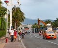 Central street with pedestrians and motorists