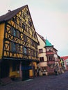 Central street of Riquewihr village in Alsace, France with colorful traditional half-timbered houses Royalty Free Stock Photo