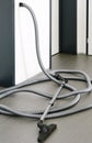 Central vacuum cleaner hose in living room