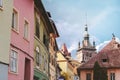 The centre of Sighisoara citadel with the Clock Tower and colorful houses Royalty Free Stock Photo