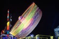 Centrifuge ferris wheel moving at night Royalty Free Stock Photo