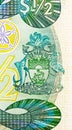 50 Cents banknote, Bank of Bahamas, closeup bill fragment shows Coat of Arms of Bahamas