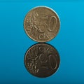 50 cents, Euro money coin on blue with reflection