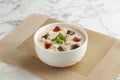 Century Egg with Minced Pork Congee served in a bowl isolated on mat side view on grey marble background Royalty Free Stock Photo