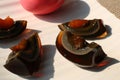 Century egg, traditional chineese and thai food. Whole egg with pink eggshell and black peeled egg sliced into quarters