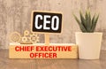 CEO wooden blocks word on grey background. CEO - chief executive officer, information concepts