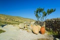 Ceramic ancient amphora for wine on a background of mountains outdoors Royalty Free Stock Photo