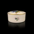 Ceramic antique jewelry box with floral patterns.