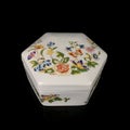 Ceramic antique jewelry box with floral patterns.