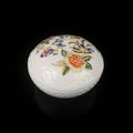 Ceramic antique jewelry box with floral patterns.