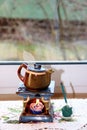 ceramic aroma lamp in the form of a teapot with a candle and incense