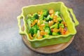 Ceramic baking dish with fresh vegetables. Organic vegetarian meal. Healthy vegetable eating. Summer vitamine food