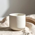 Ceramic Beige Cup on Linen Fabric in Studio Light Still Life Texture Royalty Free Stock Photo